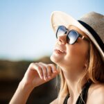 beautiful young cheerful girl wearing glasses hat rests morning beach 176420 5862